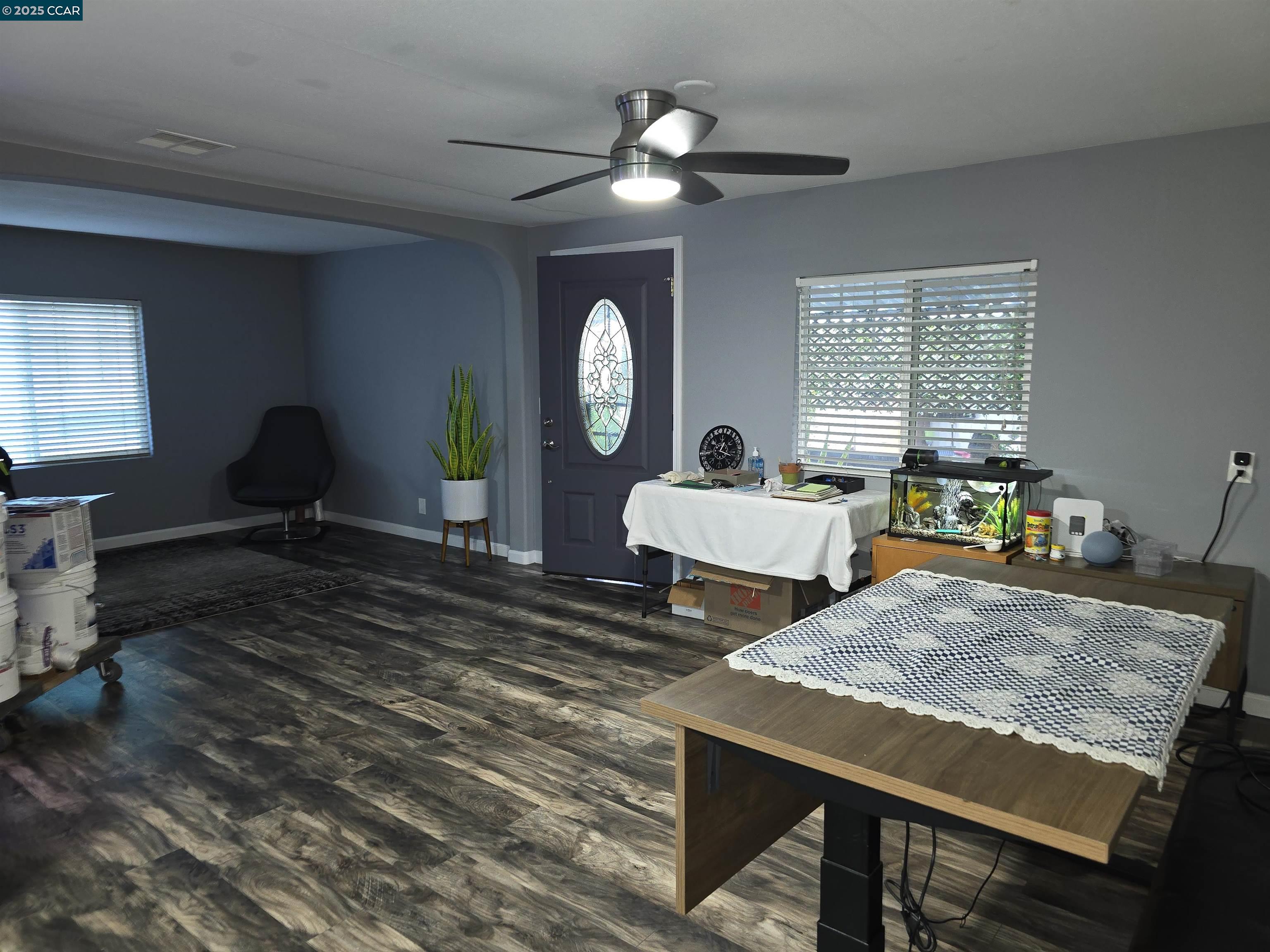 16711 Marsh Creek Road, Unit 112 Clayton, CA 94517 - Photo 13 of 30 a living room with furniture a chandelier a rug and a large window