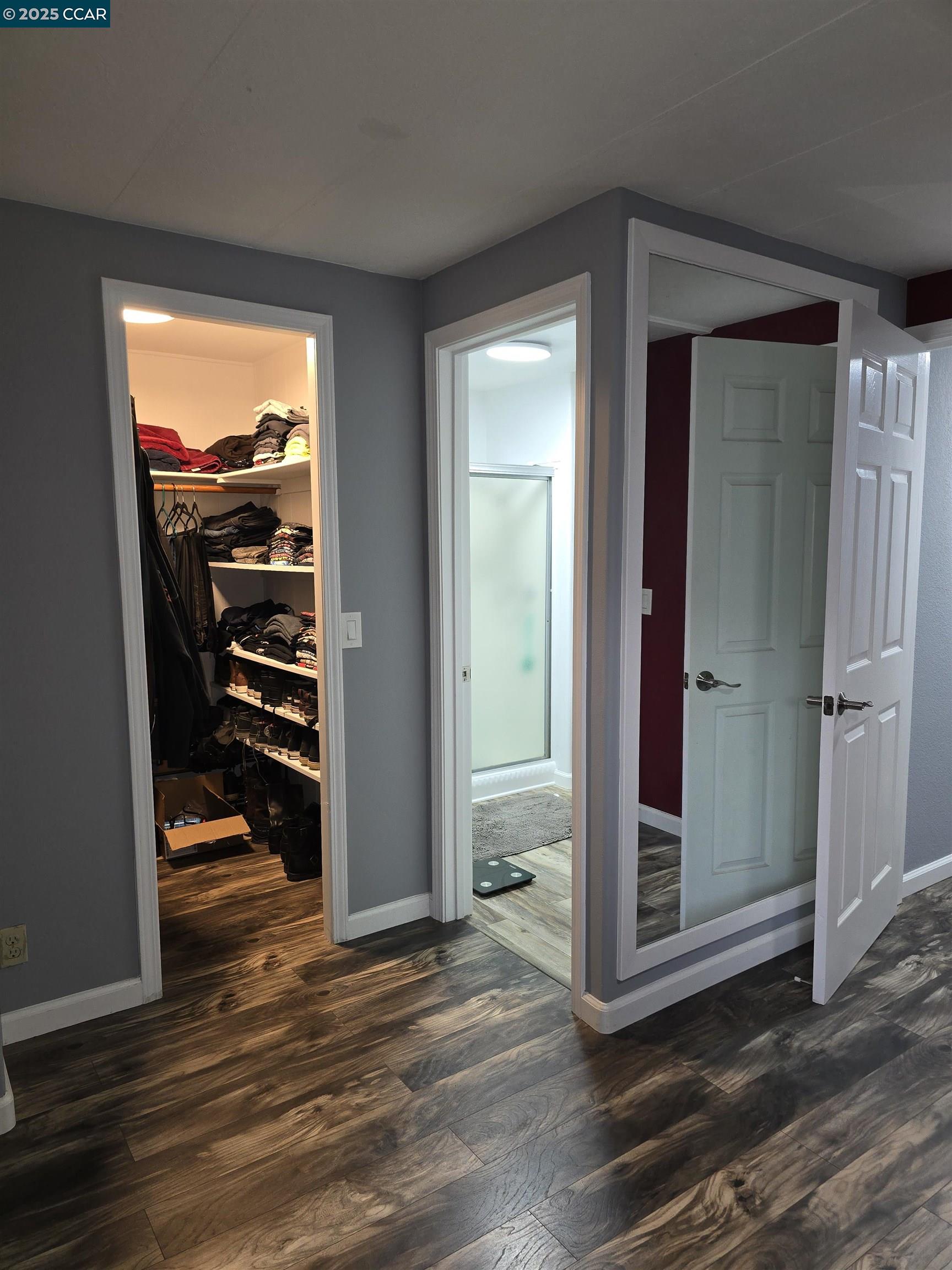 16711 Marsh Creek Road, Unit 112 Clayton, CA 94517 - Photo 24 of 30 a view of an empty room with wooden floor and a window
