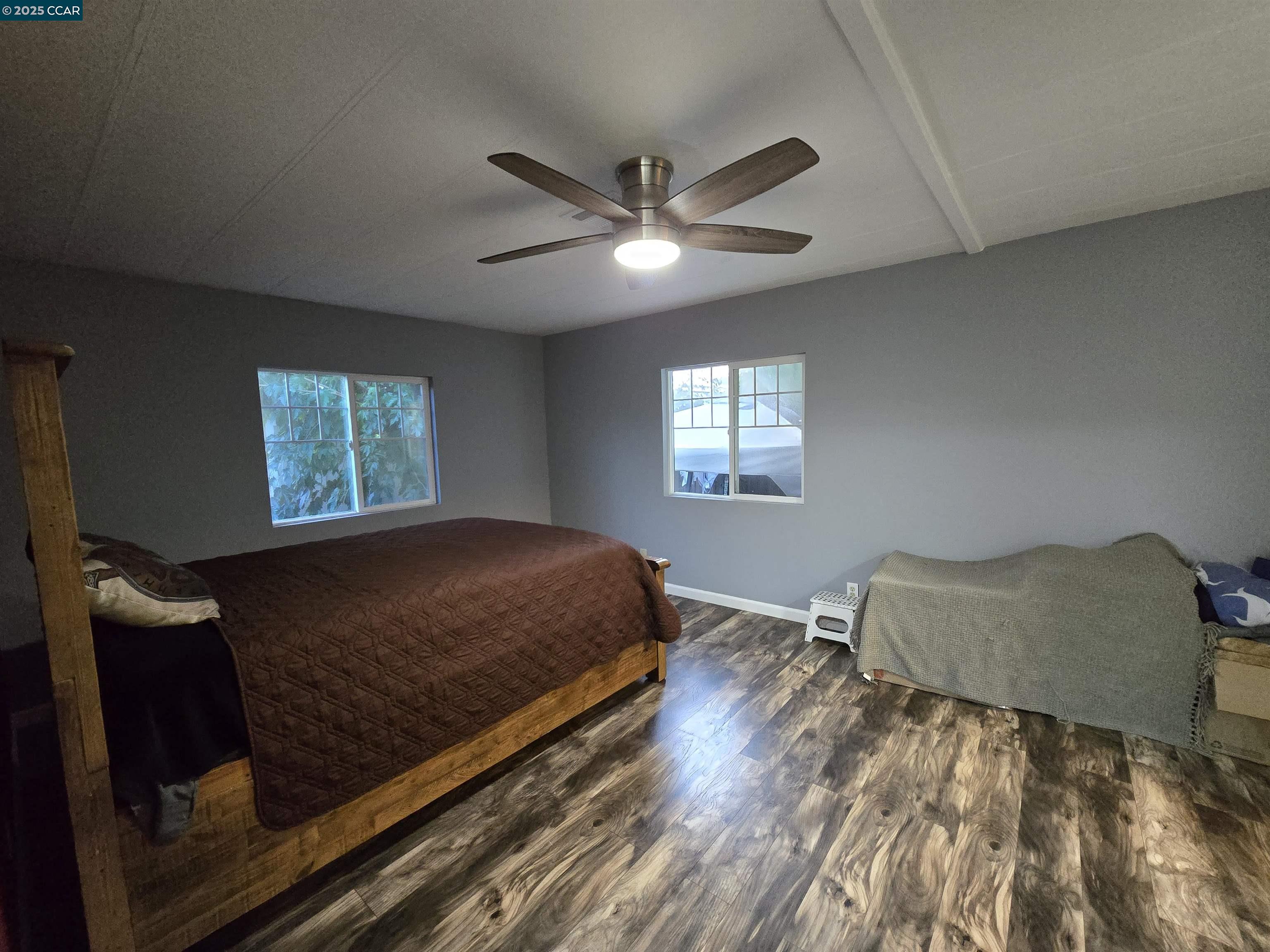 16711 Marsh Creek Road, Unit 112 Clayton, CA 94517 - Photo 25 of 30 a bed sitting in a bedroom next to a window