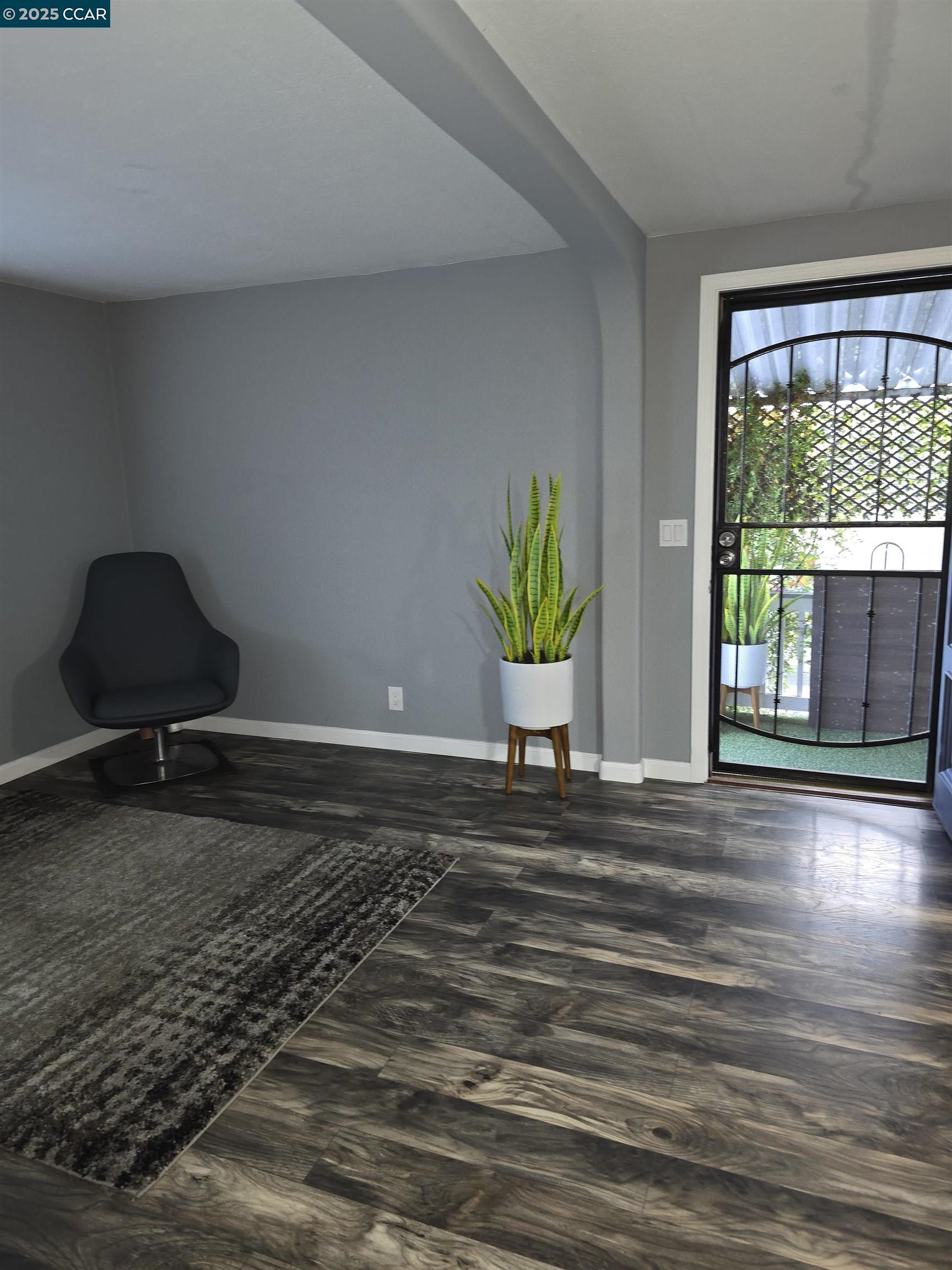16711 Marsh Creek Road, Unit 112 Clayton, CA 94517 - Photo 9 of 30 a view of a livingroom with wooden floor and a window