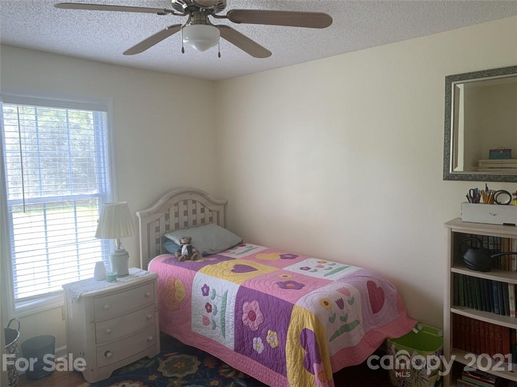 1822 Sharon Road York, SC 29745 - Photo 11 of 39 a bedroom with a bed and a window