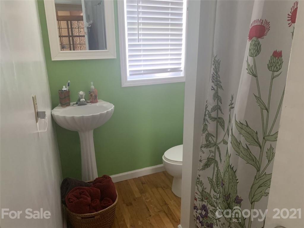 1822 Sharon Road York, SC 29745 - Photo 14 of 39 a bathroom with a toilet sink and mirror