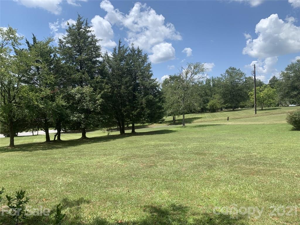 1822 Sharon Road York, SC 29745 - Photo 17 of 39 a view of outdoor space with green field and trees