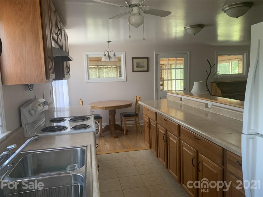 1822 Sharon Road York, SC 29745 - Photo 23 of 39 a kitchen with stainless steel appliances a sink stove and cabinets