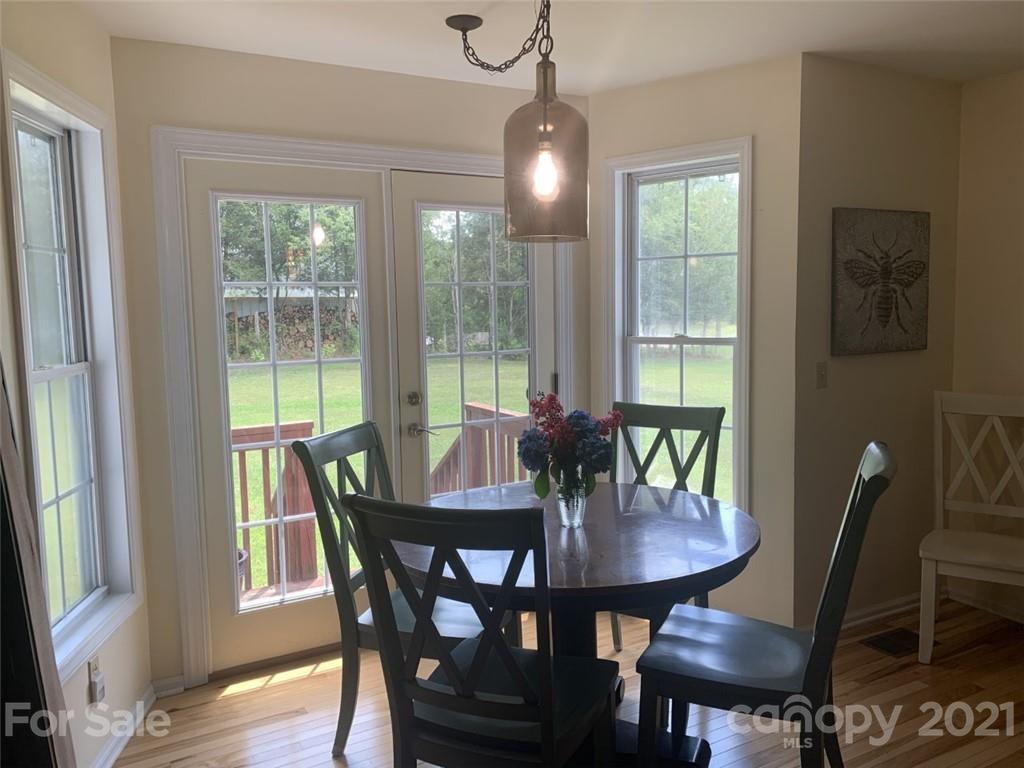 1822 Sharon Road York, SC 29745 - Photo 7 of 39 a view of a dining room with furniture window and wooden floor