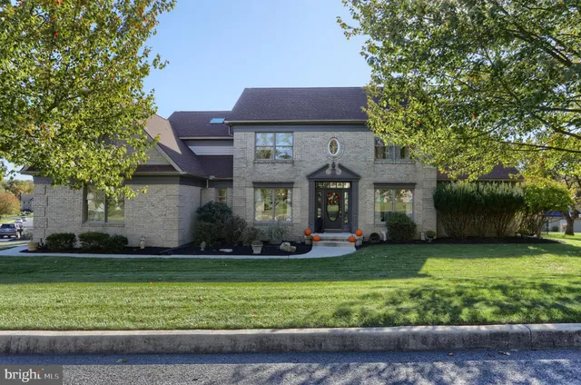 a living room with furniture a flat screen tv and gym equipment
