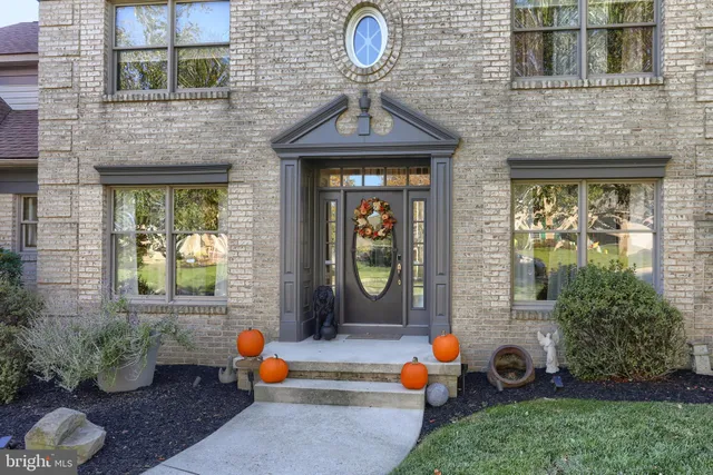 a kitchen with kitchen island a stove and a refrigerator