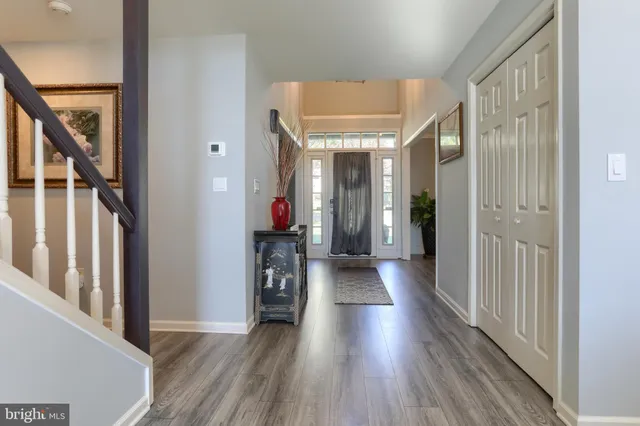 a room with pool table and windows