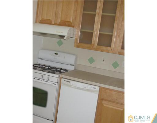 71 Sturgis Road Edison, NJ 08817 - Photo 3 of 11 a utility room with dryer and washer