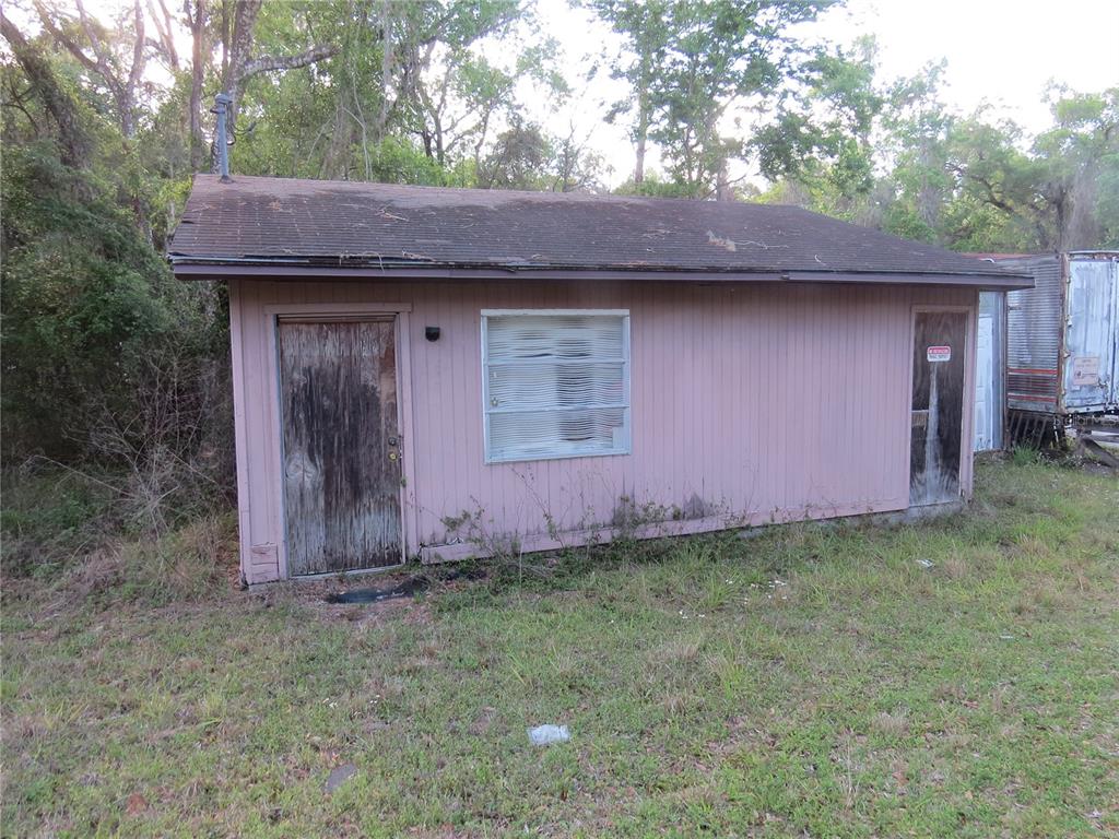28380 Forbes Street Nobleton, FL 34661 - Photo 13 of 19 a backyard of a house with lots of green space