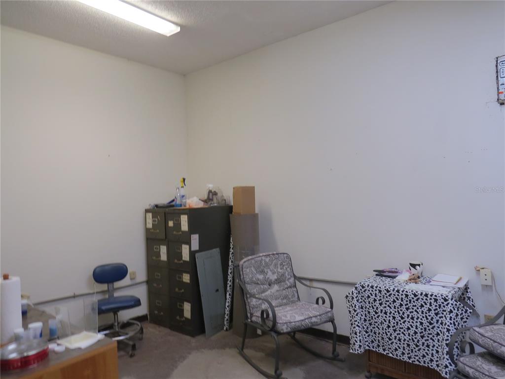 28380 Forbes Street Nobleton, FL 34661 - Photo 6 of 19 a room with a couch and wooden floor