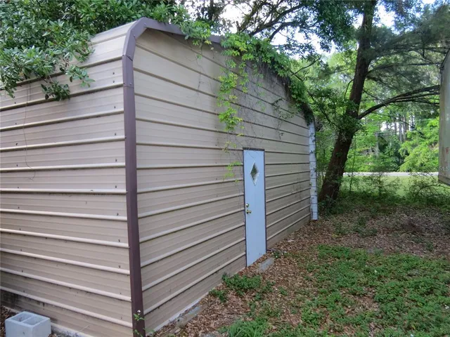 a backyard of a house with yard and garage