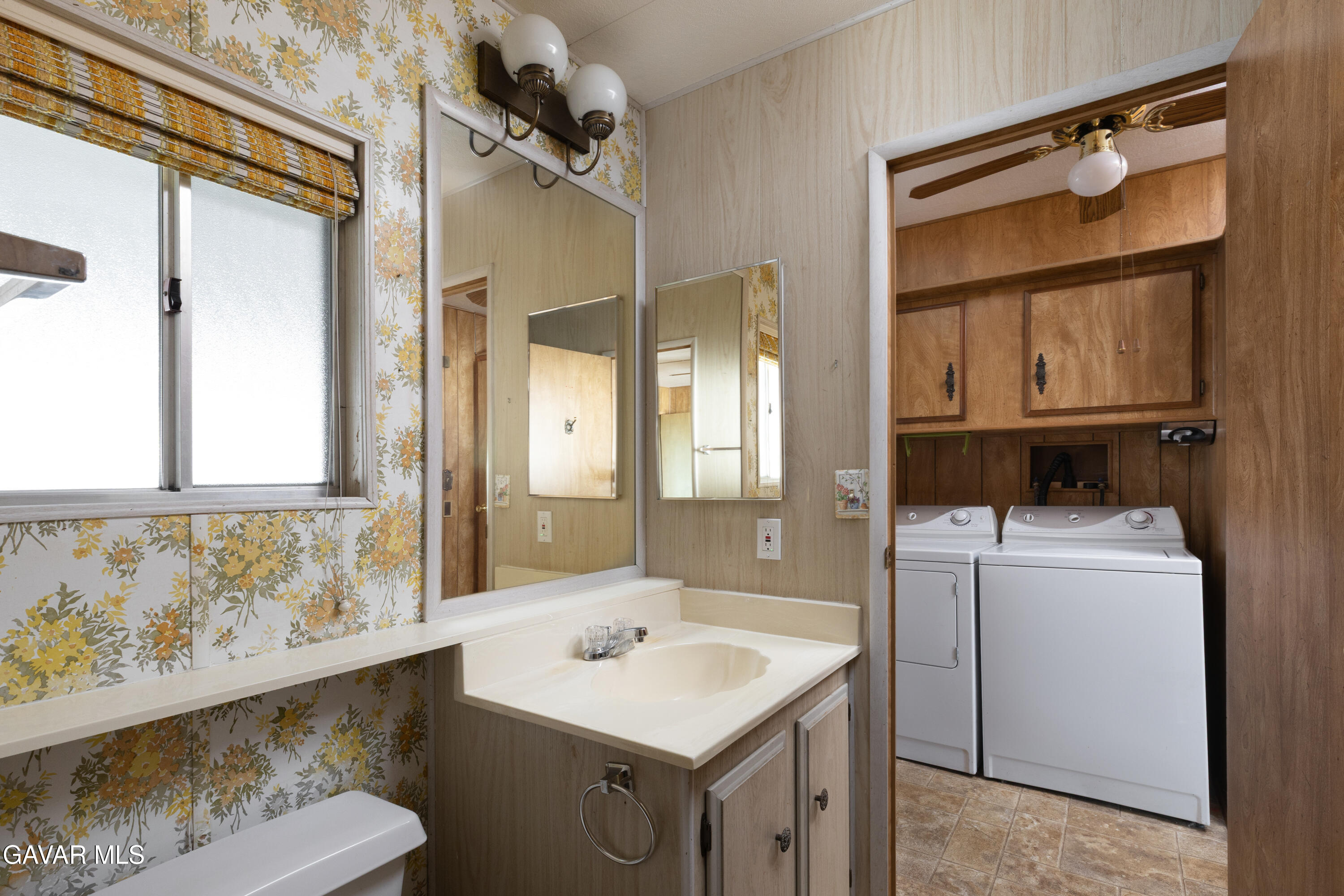 275 South Worthington Street Spring Valley, CA 91977 - Photo 19 of 30 a bathroom with a sink and a mirror