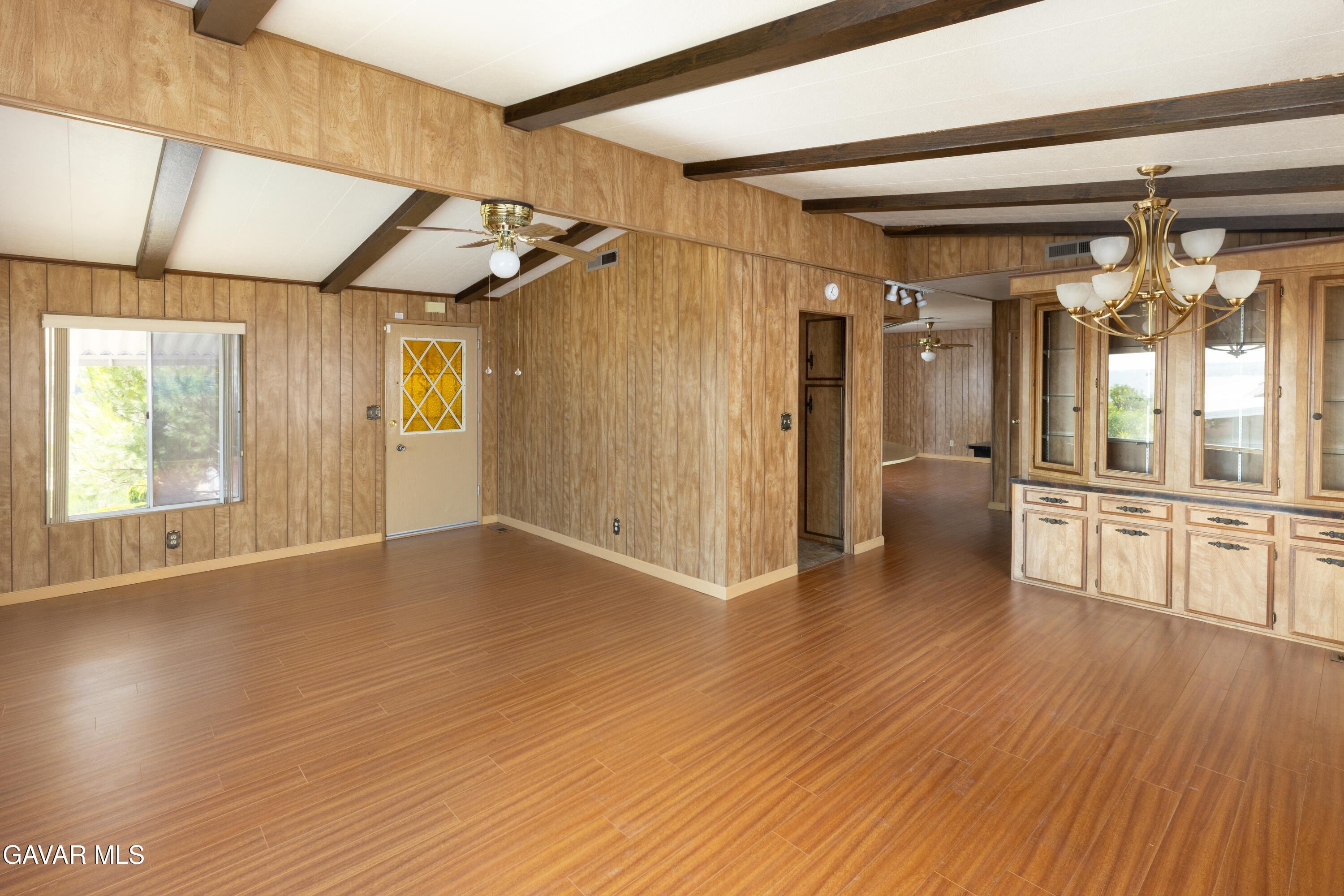 275 South Worthington Street Spring Valley, CA 91977 - Photo 7 of 30 a view of empty room with wooden floor and fan