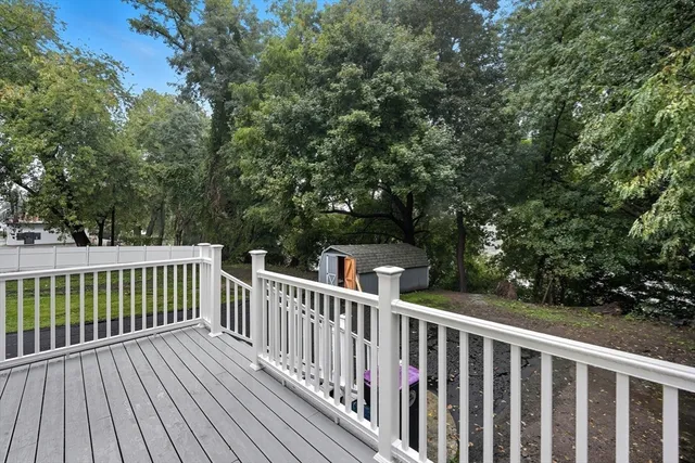 a view of deck with wooden floor and fence