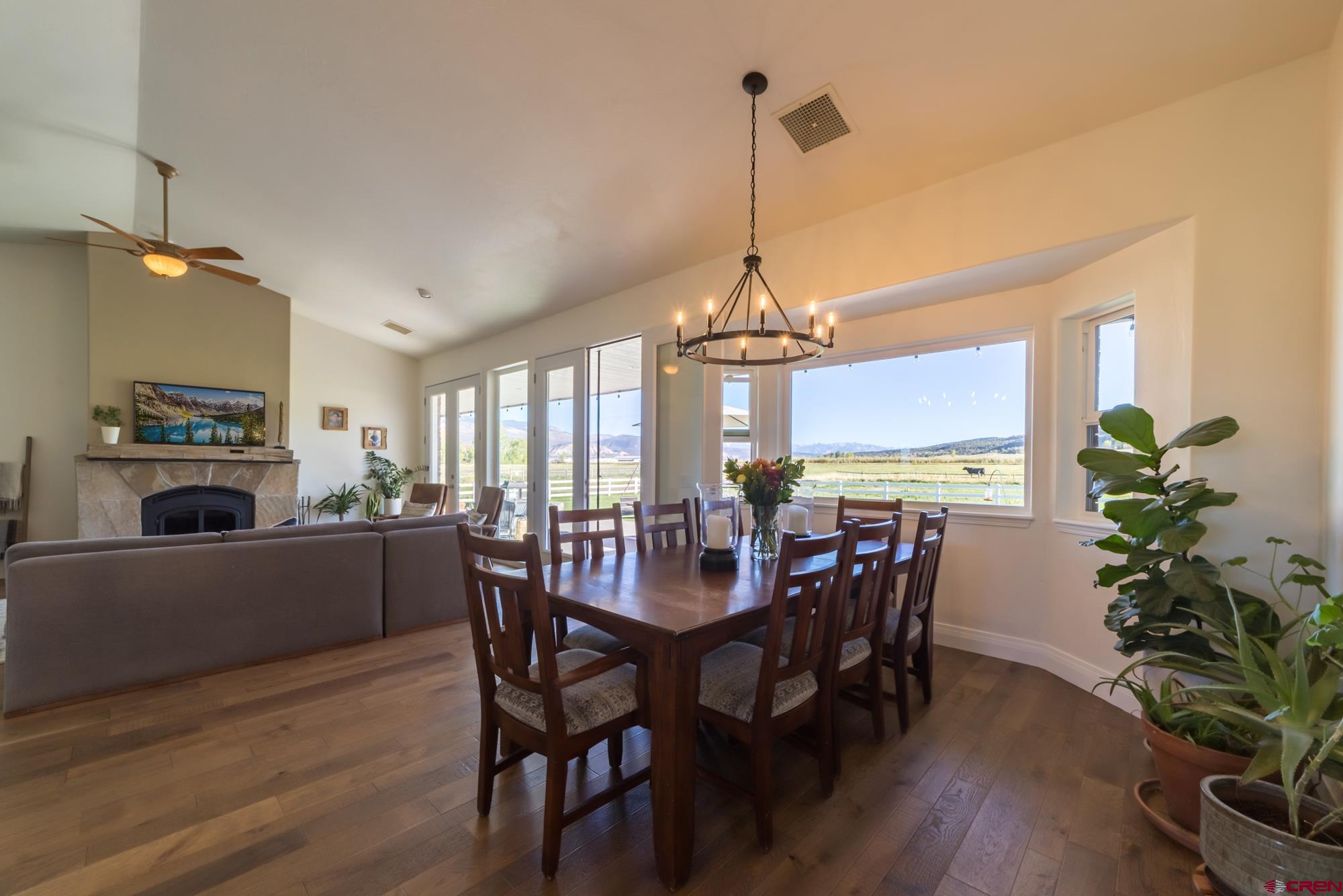 68041 Ute Vly Drive Montrose, CO 81403 - Photo 11 of 35 a view of a dining room with furniture window and wooden floor