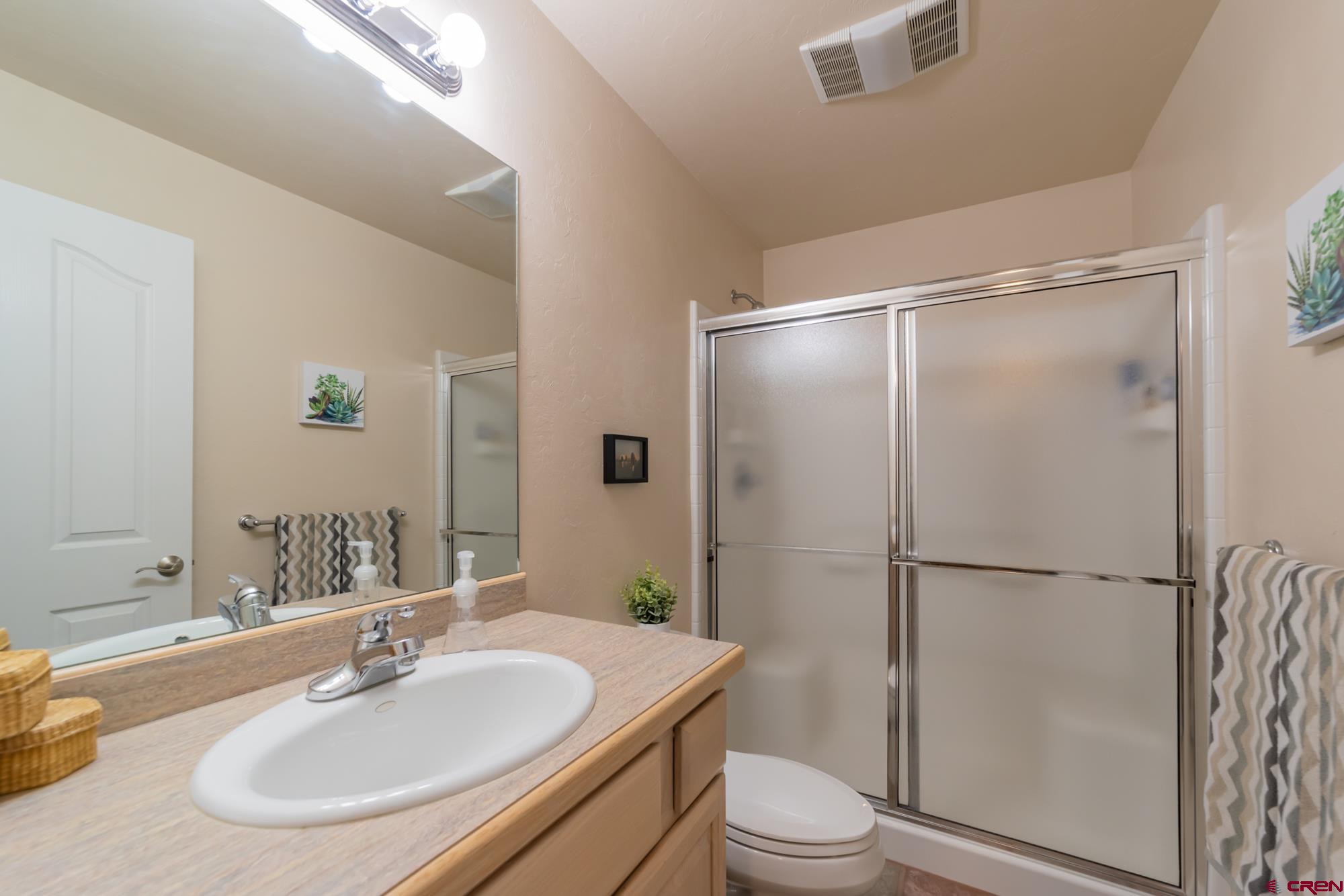 68041 Ute Vly Drive Montrose, CO 81403 - Photo 27 of 35 a bathroom with a sink toilet and shower