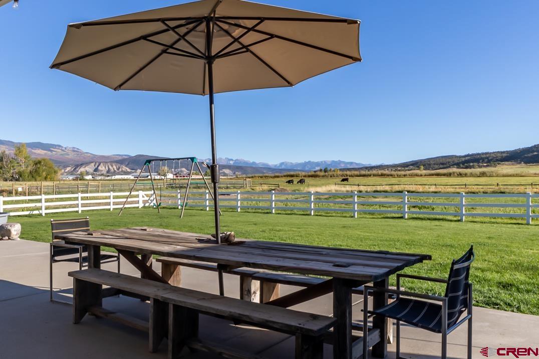 68041 Ute Vly Drive Montrose, CO 81403 - Photo 3 of 35 a view of a swimming pool and outdoor seating