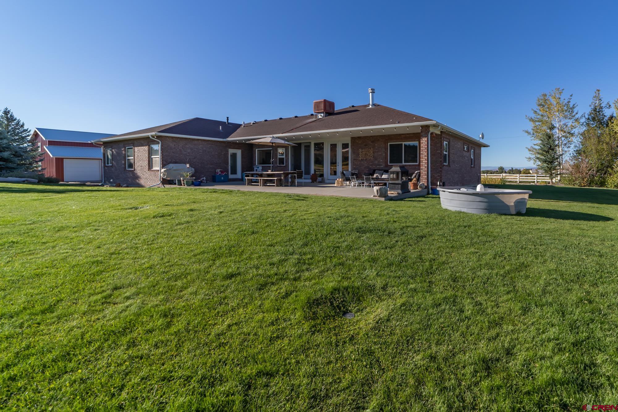 68041 Ute Vly Drive Montrose, CO 81403 - Photo 31 of 35 a front view of house with yard and seating area