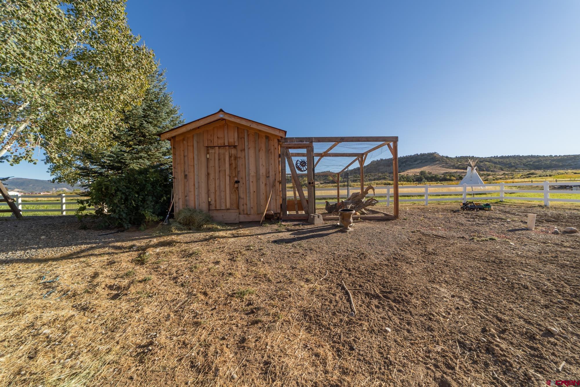 68041 Ute Vly Drive Montrose, CO 81403 - Photo 34 of 35 a view of a house with a yard