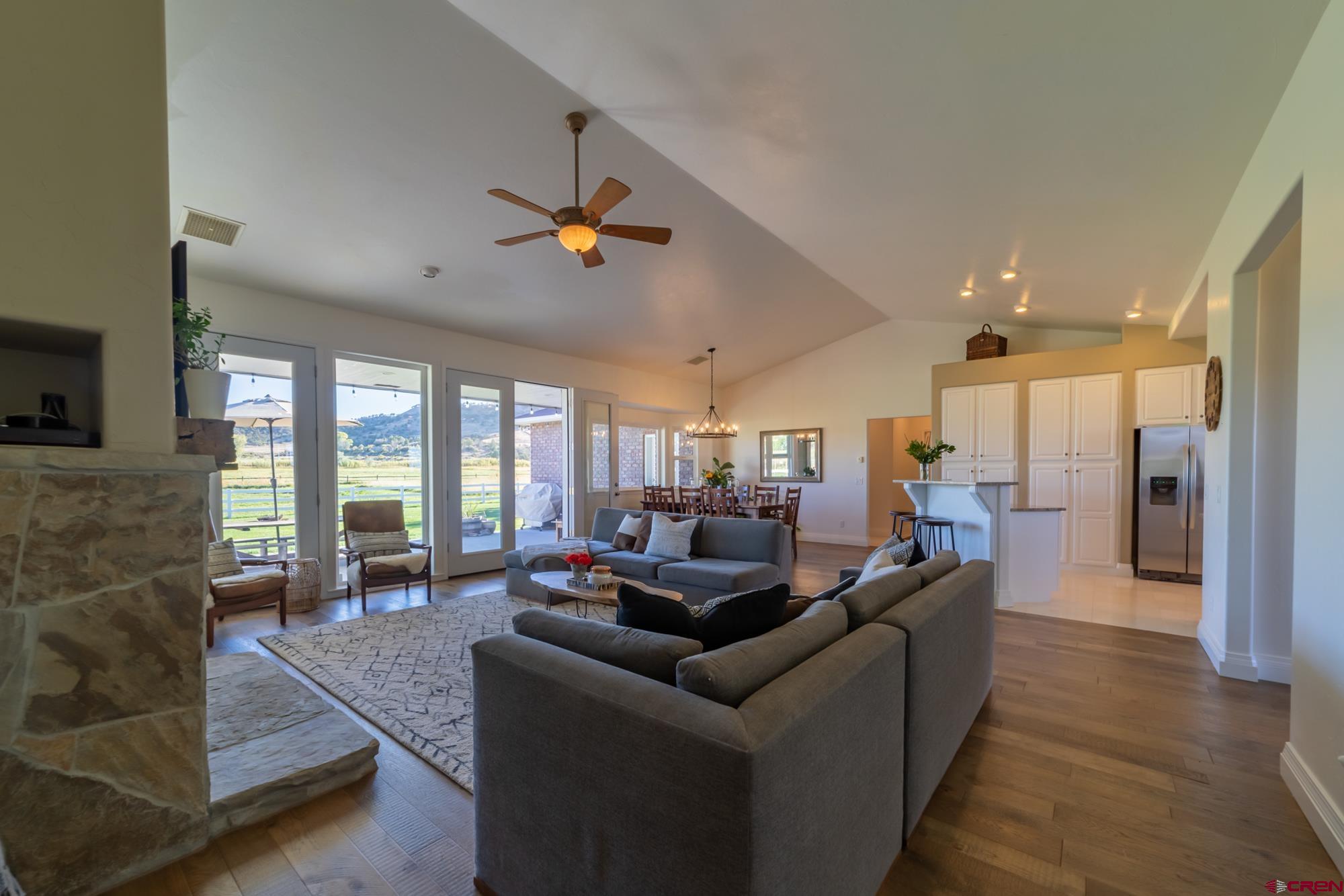 68041 Ute Vly Drive Montrose, CO 81403 - Photo 9 of 35 a living room with furniture and a fireplace