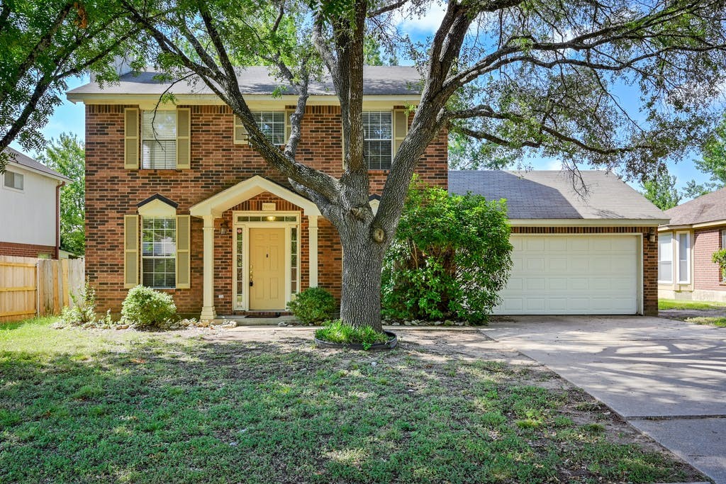 2008 Heather Drive Cedar Park, TX 78613 - Photo 1 of 1 a front view of a house with garden