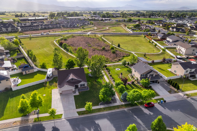 2485 South 1100th Street West Logan, UT 84321 - Photo 45 of 53 Aerial perspective showcasing a residential neighborhood with green spaces