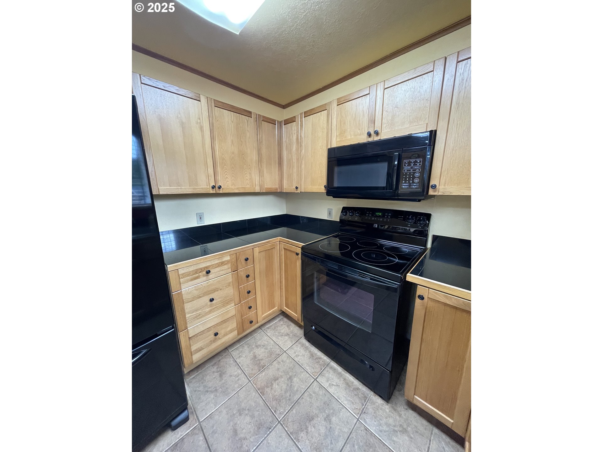 1820 Dogwood Avenue Reedsport, OR 97467 - Photo 14 of 29 a kitchen with stainless steel appliances granite countertop a stove a sink and a microwave