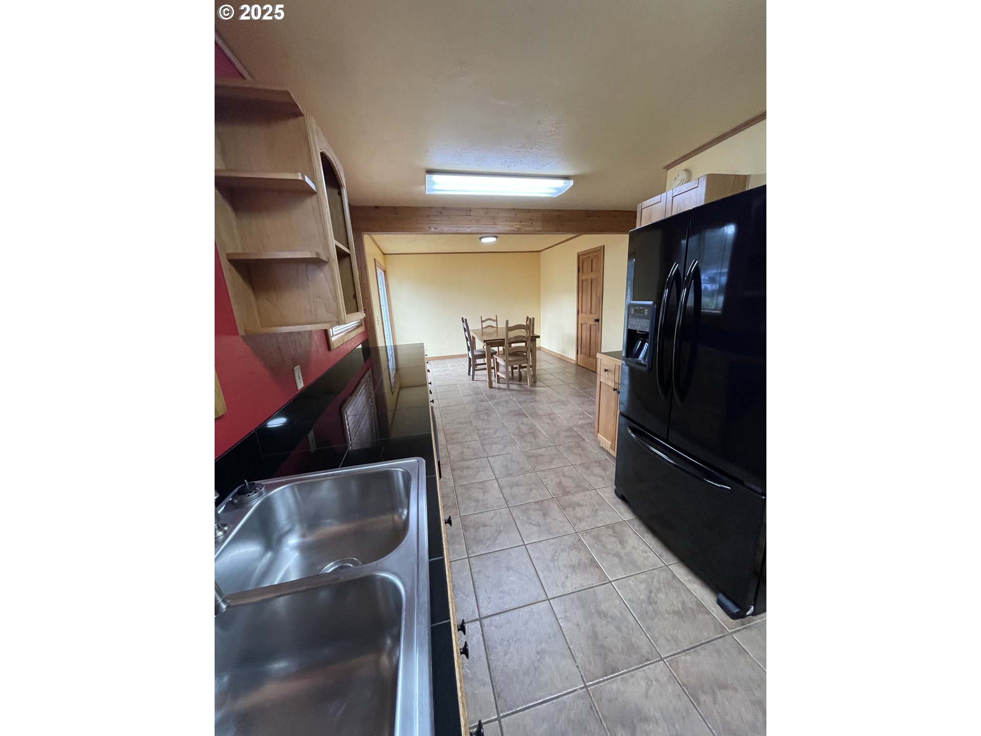 1820 Dogwood Avenue Reedsport, OR 97467 - Photo 15 of 29 a hallway with a view of living room with a sink and cabinets