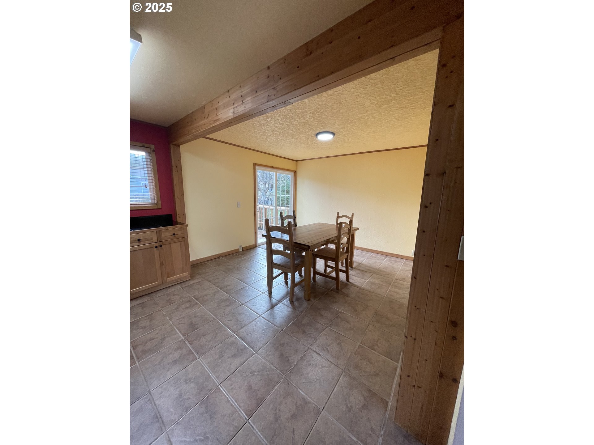1820 Dogwood Avenue Reedsport, OR 97467 - Photo 16 of 29 a dining room with furniture and a window