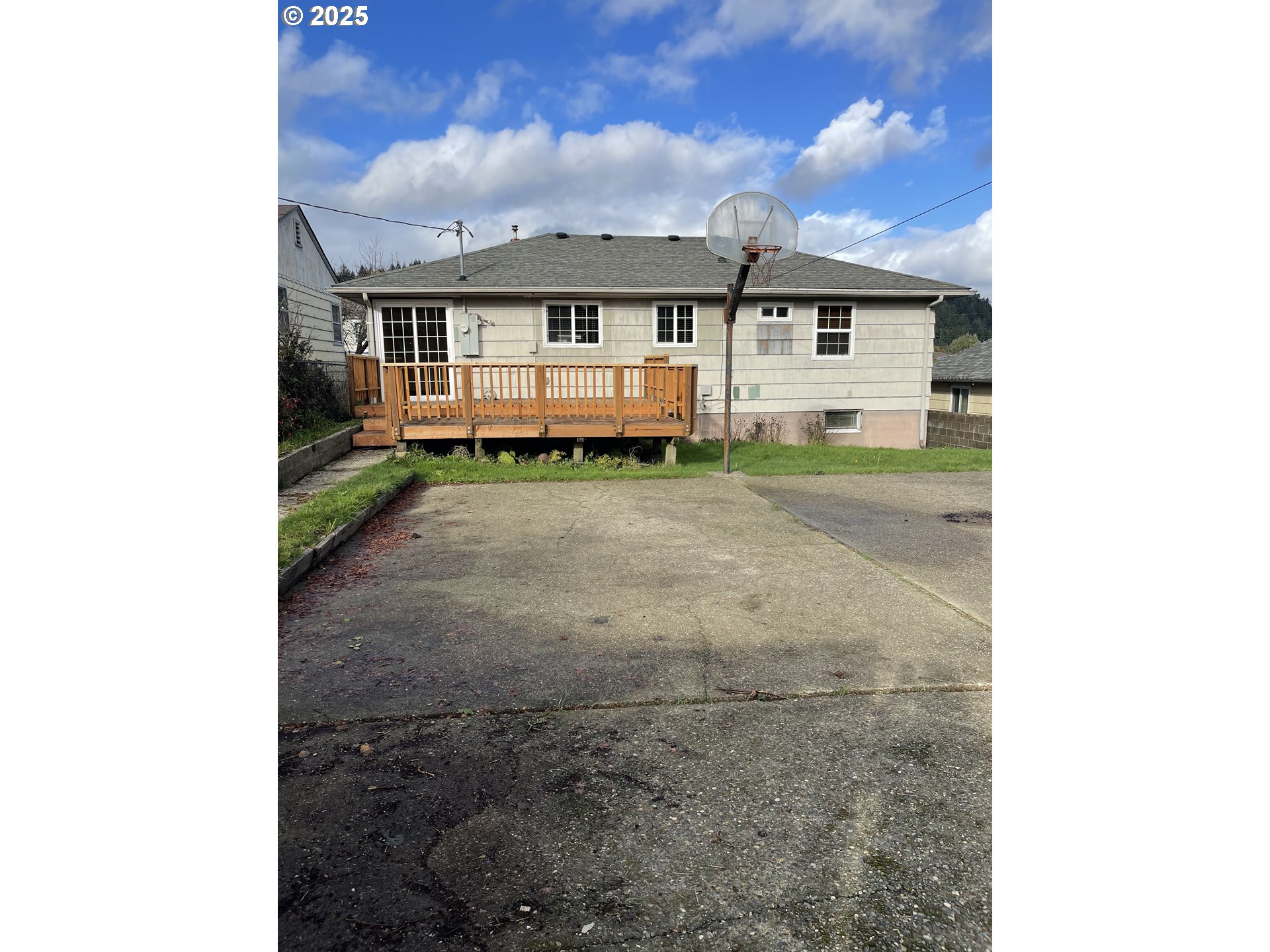 1820 Dogwood Avenue Reedsport, OR 97467 - Photo 29 of 29 a view of a house with a porch and a floor to ceiling window
