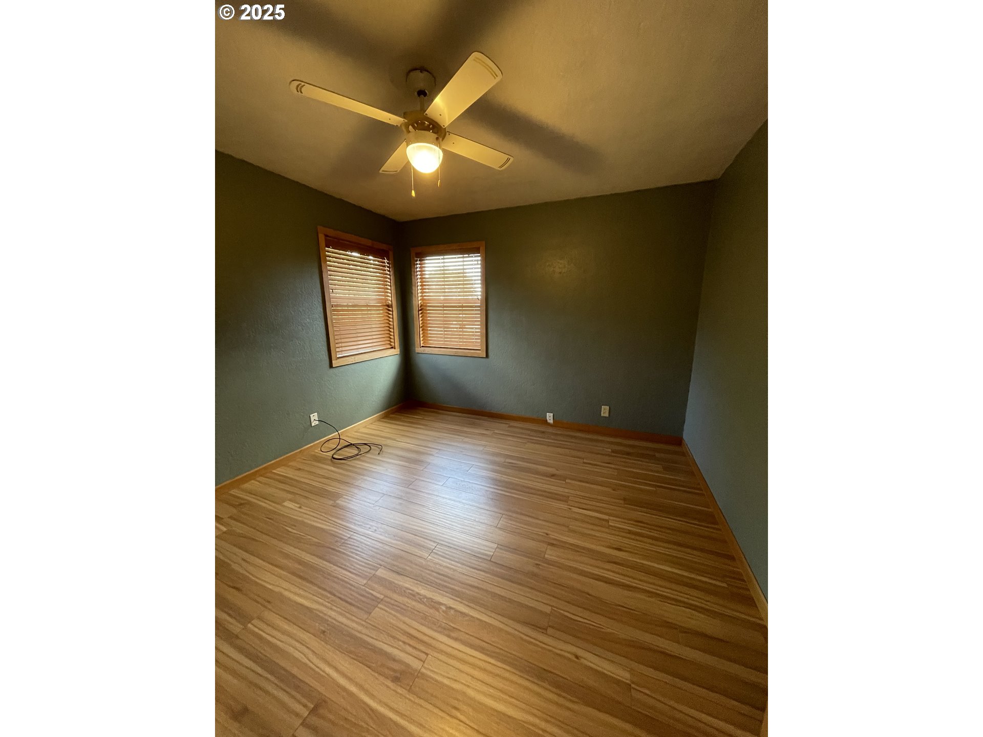 1820 Dogwood Avenue Reedsport, OR 97467 - Photo 6 of 29 a view of an empty room with wooden floor and a window