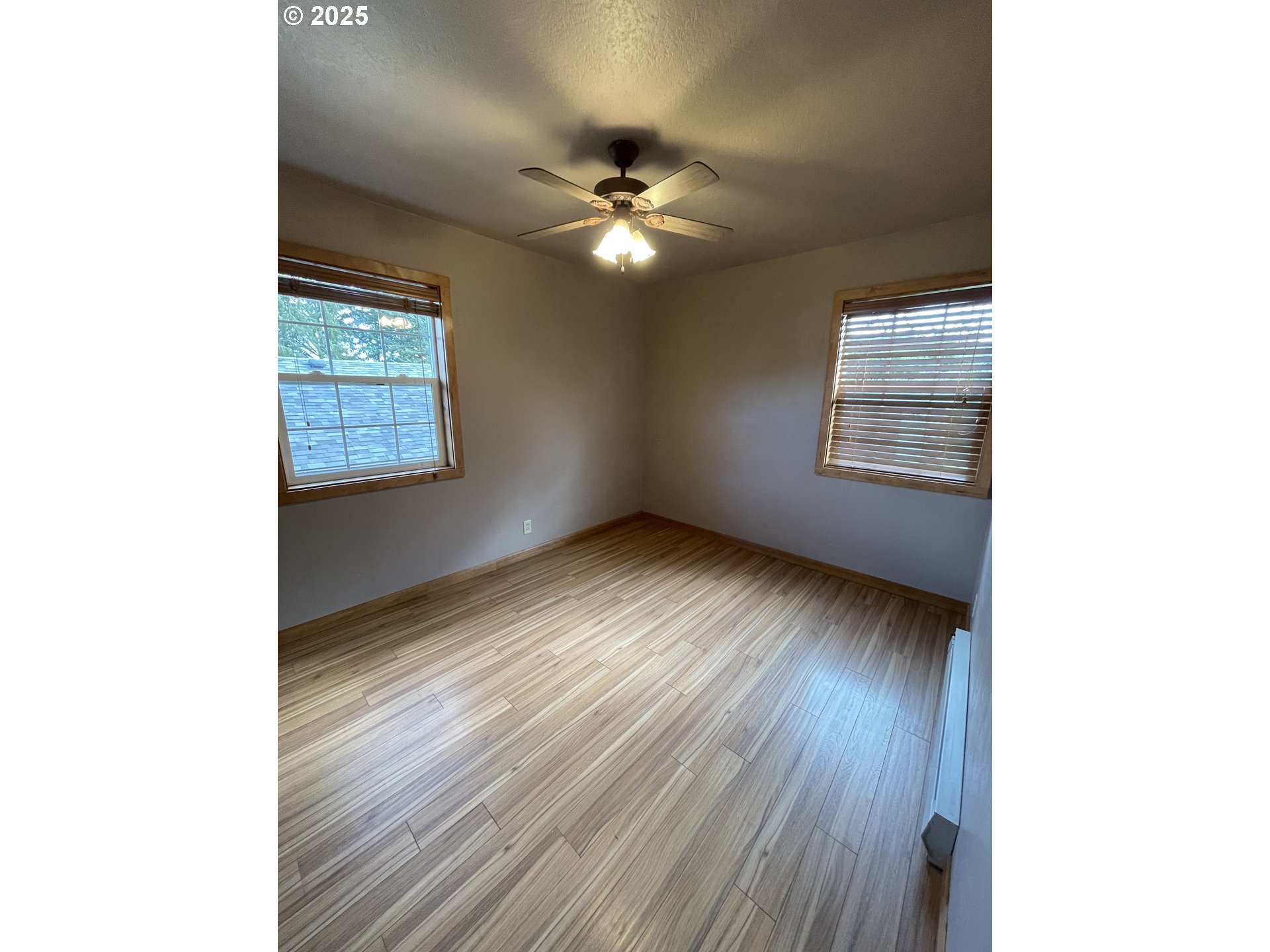 1820 Dogwood Avenue Reedsport, OR 97467 - Photo 9 of 29 a view of an empty room with wooden floor and a window