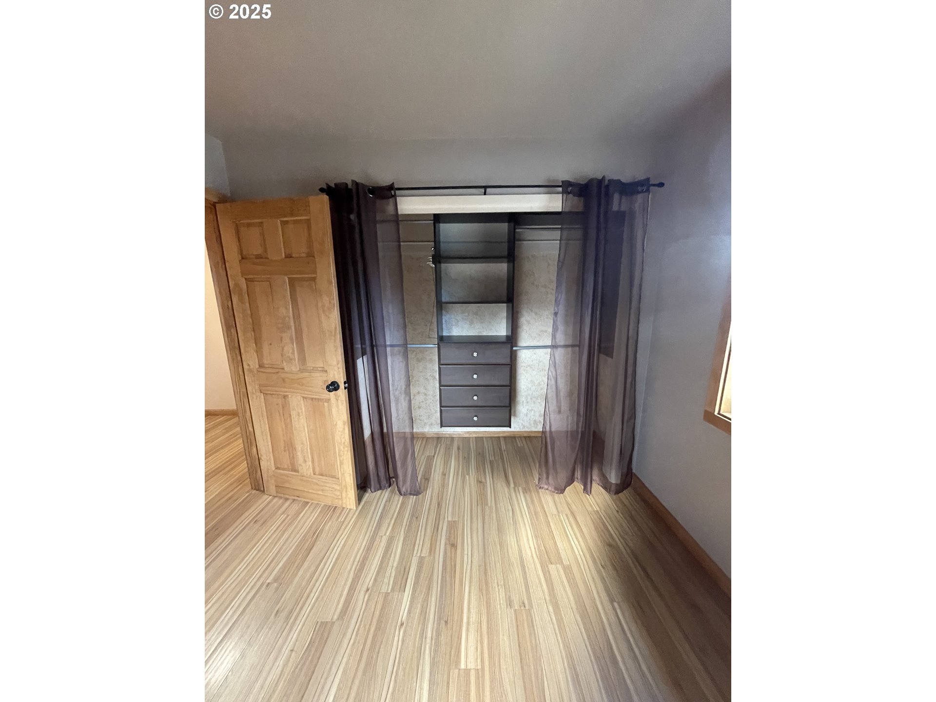 1820 Dogwood Avenue Reedsport, OR 97467 - Photo 10 of 29 a view of a hallway with wooden floor