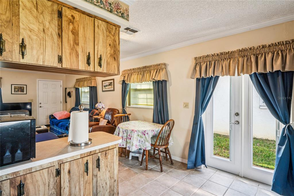 6709 Timbercove Lane, Unit 6709 New Port Richey, FL 34653 - Photo 14 of 52 a view of an chairs and table in the balcony