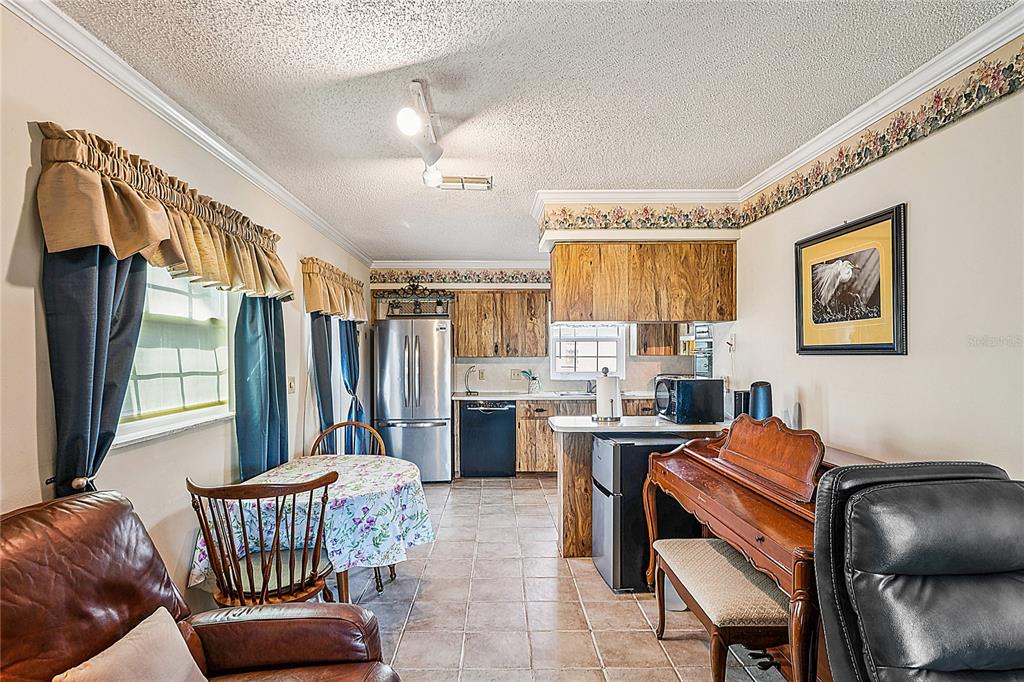 6709 Timbercove Lane, Unit 6709 New Port Richey, FL 34653 - Photo 17 of 52 a workspace with furniture and window
