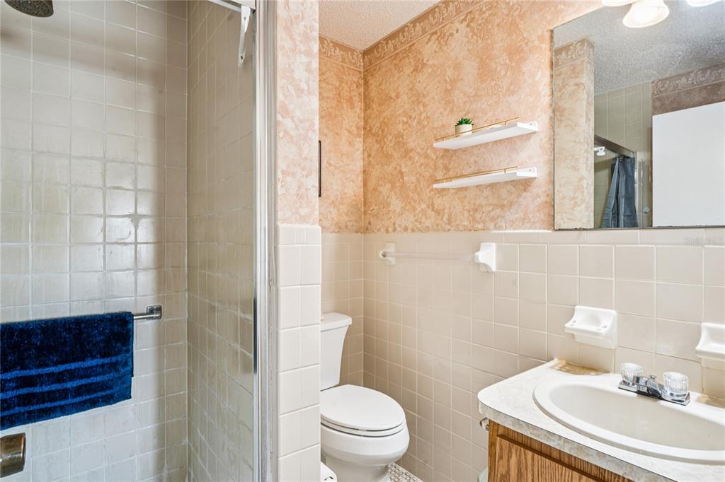 6709 Timbercove Lane, Unit 6709 New Port Richey, FL 34653 - Photo 21 of 52 a bathroom with a sink a toilet and shower
