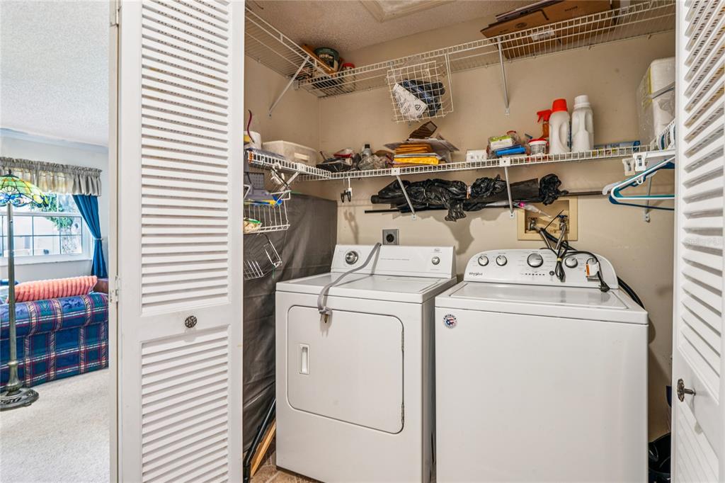 6709 Timbercove Lane, Unit 6709 New Port Richey, FL 34653 - Photo 27 of 52 a utility room with dryer and washer