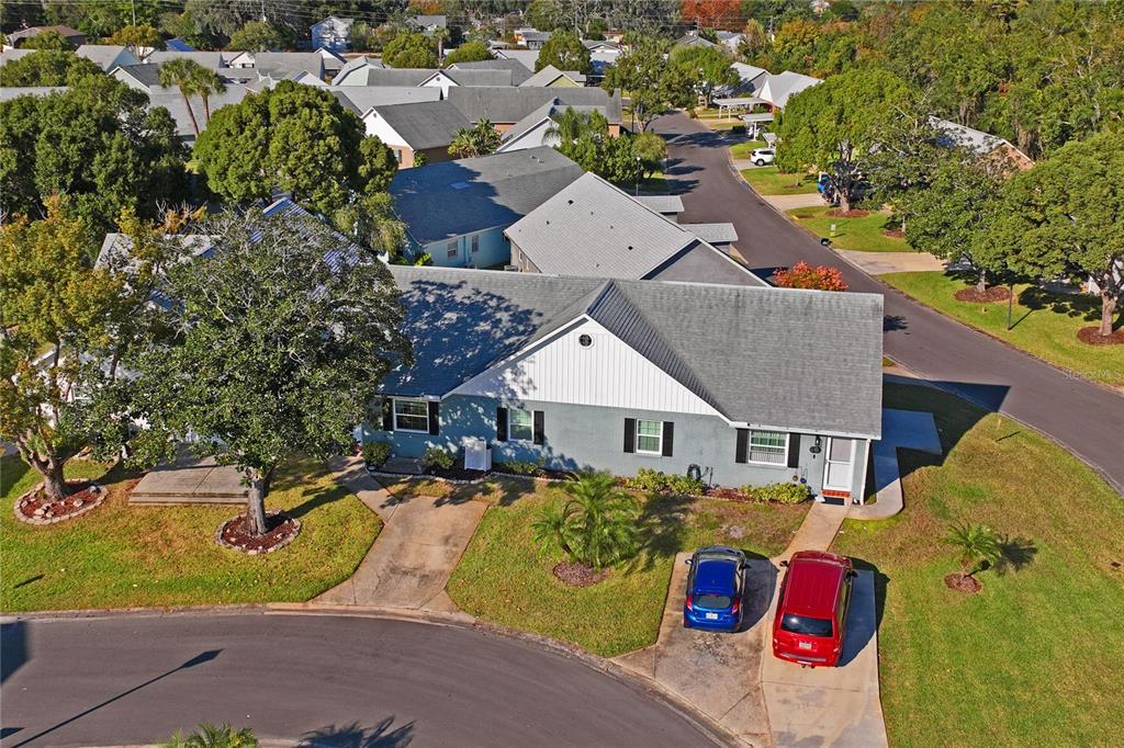 6709 Timbercove Lane, Unit 6709 New Port Richey, FL 34653 - Photo 30 of 52 an aerial view of a house with a yard and lake view