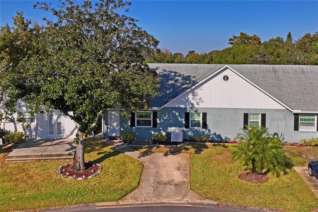 6709 Timbercove Lane, Unit 6709 New Port Richey, FL 34653 - Photo 31 of 52 a swimming pool with outdoor seating and yard