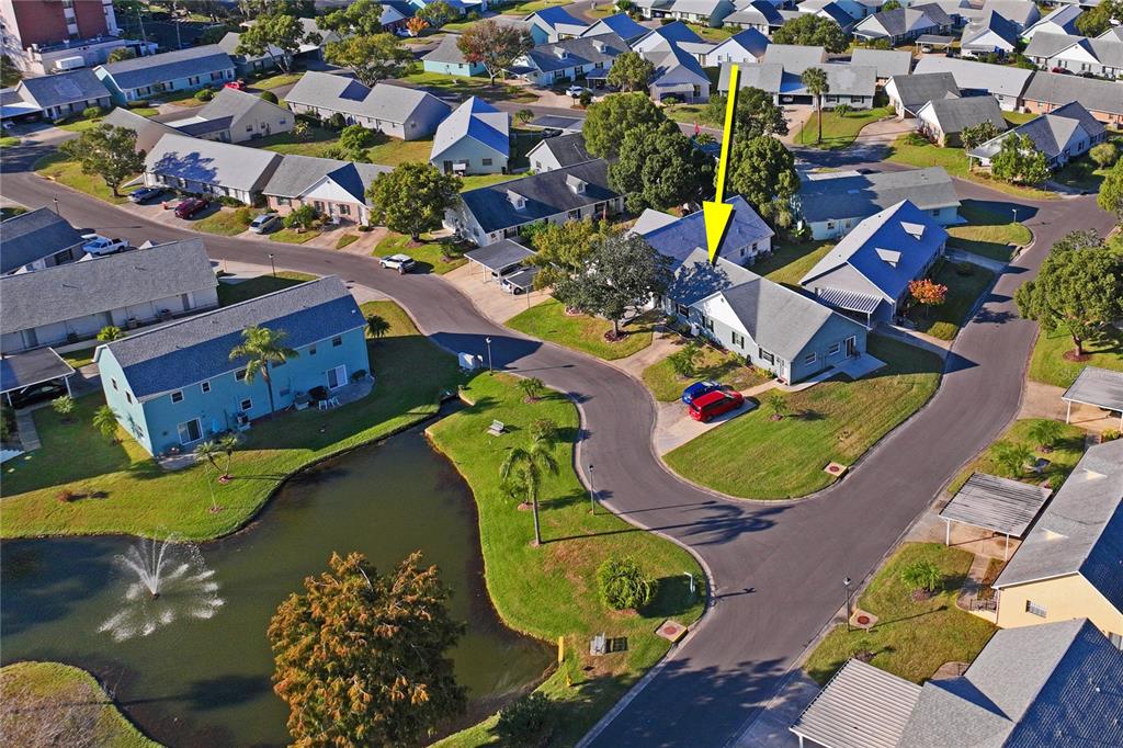 6709 Timbercove Lane, Unit 6709 New Port Richey, FL 34653 - Photo 32 of 52 an aerial view of a swimming pool patio outdoor seating and outdoor seating