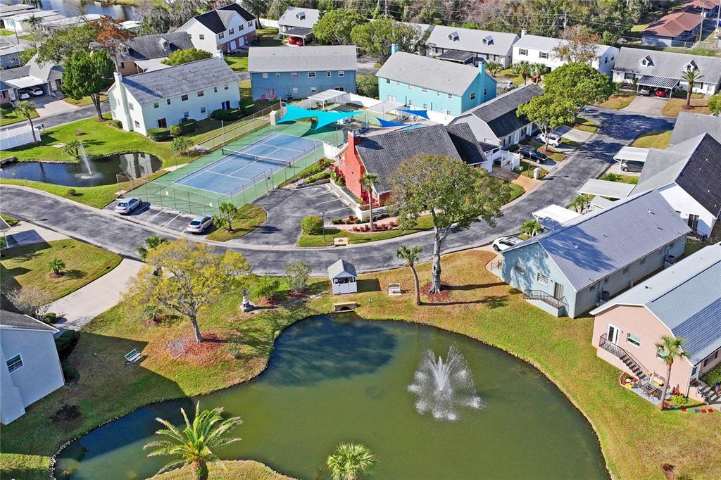 6709 Timbercove Lane, Unit 6709 New Port Richey, FL 34653 - Photo 36 of 52 an aerial view of residential houses with outdoor space
