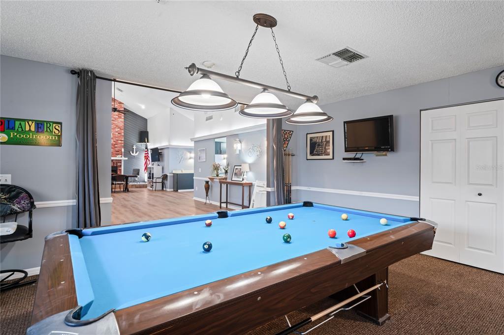 6709 Timbercove Lane, Unit 6709 New Port Richey, FL 34653 - Photo 46 of 52 a room with pool table and windows