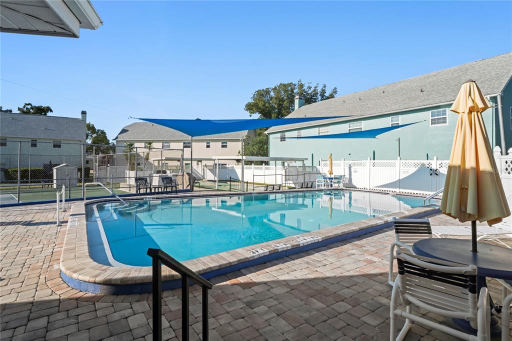 6709 Timbercove Lane, Unit 6709 New Port Richey, FL 34653 - Photo 48 of 52 a view of a chairs and table in the patio