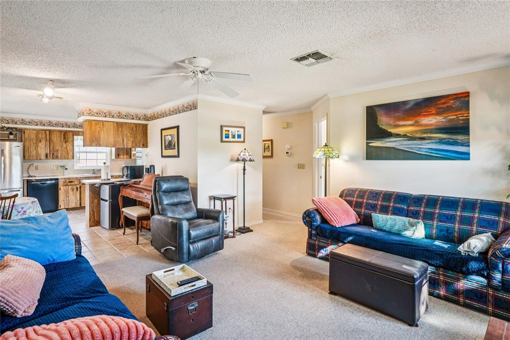 6709 Timbercove Lane, Unit 6709 New Port Richey, FL 34653 - Photo 7 of 52 a living room with furniture and wooden floor