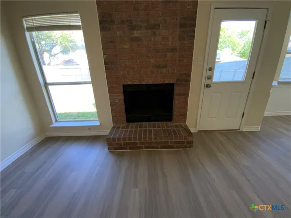 a living room with a fireplace