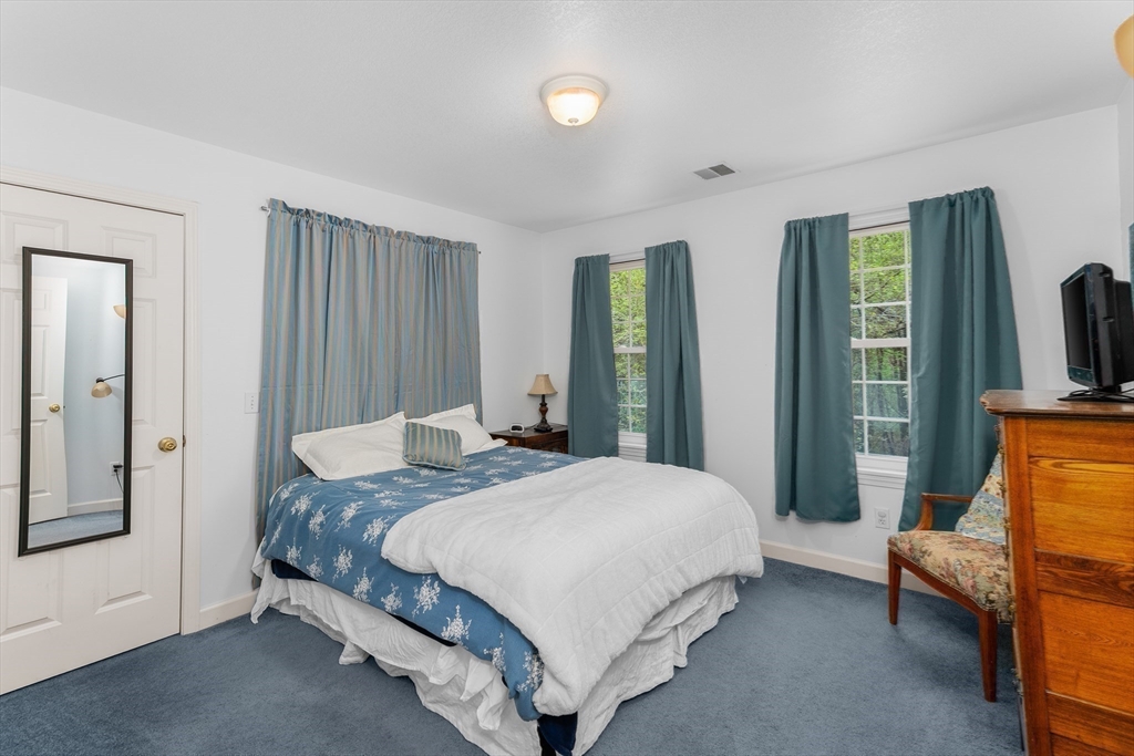 113 Greenwich Plains Road Ware, MA 01082 - Photo 27 of 42 a bedroom with a bed and a couch