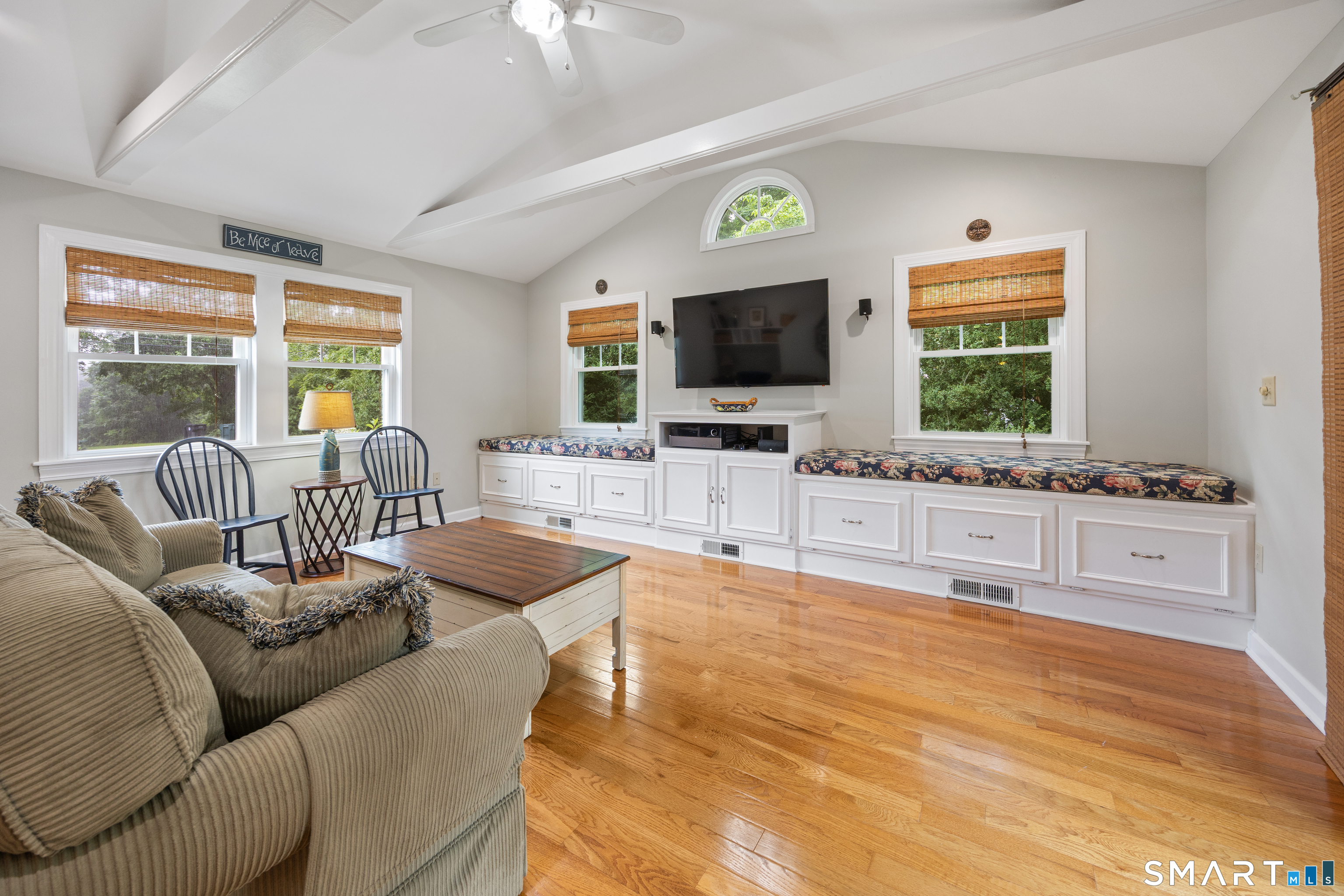 301 Wiese Road Cheshire, CT 06410 - Photo 12 of 40 This family room addition with exposed beams, built in storage and ceiling fan will become the favorite hang out spot for movie night and game night