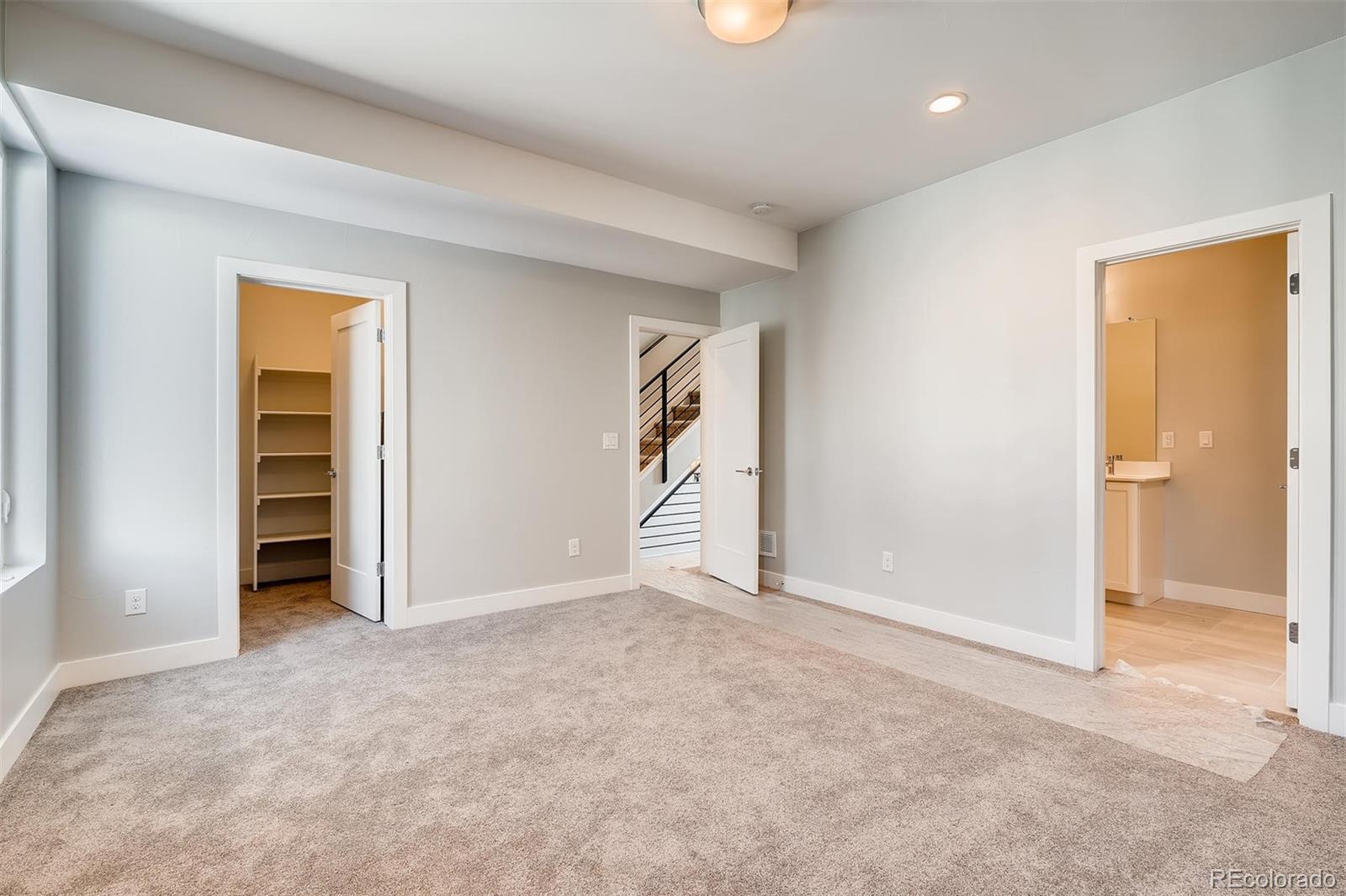 1237 Perry Street Denver, CO 80204 - Photo 12 of 37 an empty room with closet and a bathroom