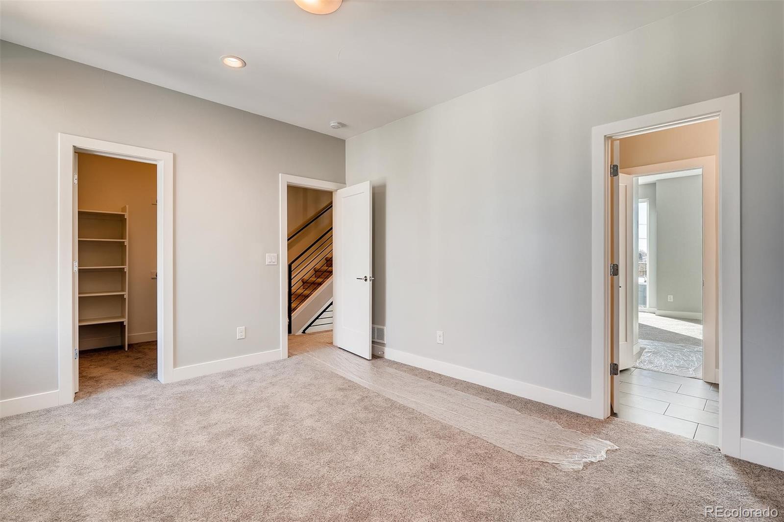 1237 Perry Street Denver, CO 80204 - Photo 18 of 37 an empty room with closet and a bathroom